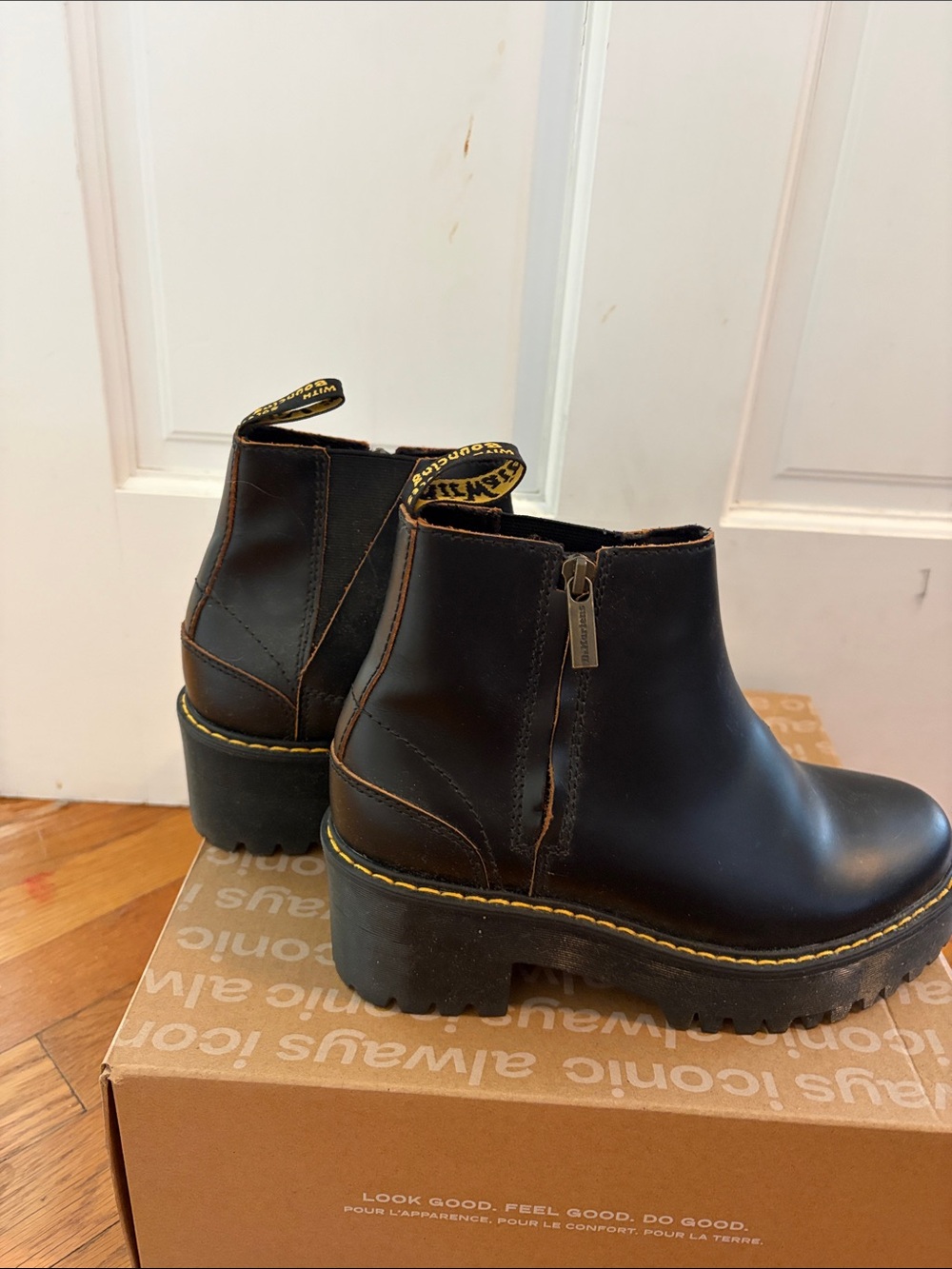 Dr. Martens Black Leather Platform Chelsea Booties with Yellow Welt Stitching